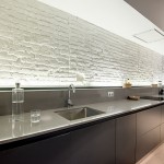 Cocina con ladrillo visto y vigas de madera de Arclinea Barcelona